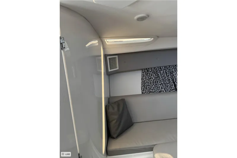  Yacht Photos Pics Interior of 2015 Intrepid 400 Cuddy boat with modern seating and patterned curtain.