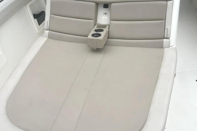  Yacht Photos Pics Boston Whaler 380 Outrage 2018 boat seating area with cup holders and cushioned backrest.