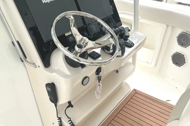  Yacht Photos Pics 2018 Boston Whaler 380 Outrage helm with steering wheel and navigation controls.