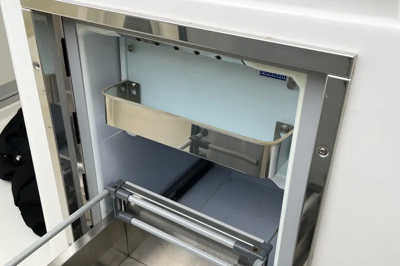  Yacht Photos Pics 2018 Boston Whaler 380 Outrage interior detail, featuring a stainless steel storage compartment.