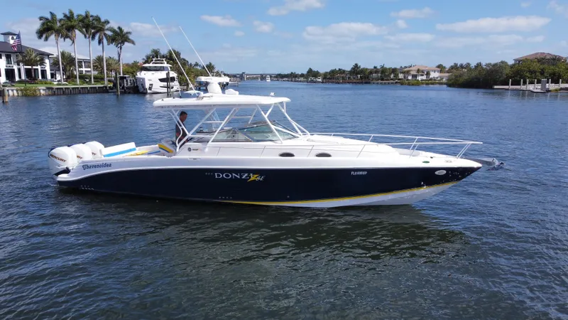 Singularity Yacht Photos Pics 2006 Donzi 38 ZSF boat cruising on a sunny day in a scenic waterway.