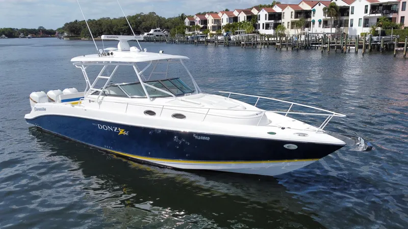 Singularity Yacht Photos Pics 2006 Donzi 38 ZSF boat on water near waterfront homes.