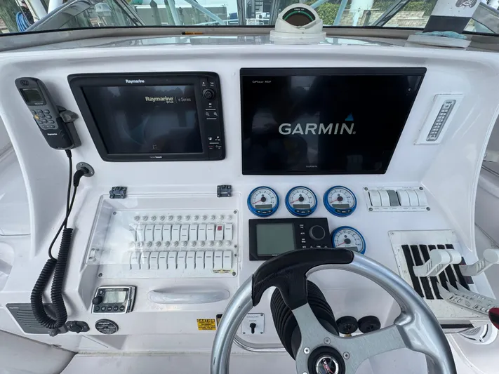 Singularity Yacht Photos Pics Control panel of a 2006 Donzi 38 ZSF boat with Garmin and Raymarine displays.