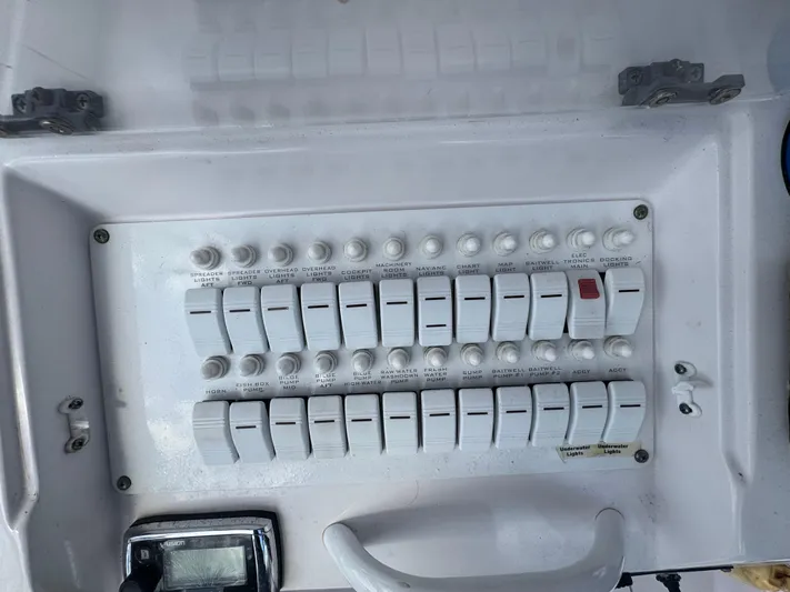 Singularity Yacht Photos Pics Control panel of a 2006 Donzi 38 ZSF boat with multiple switches and dials.