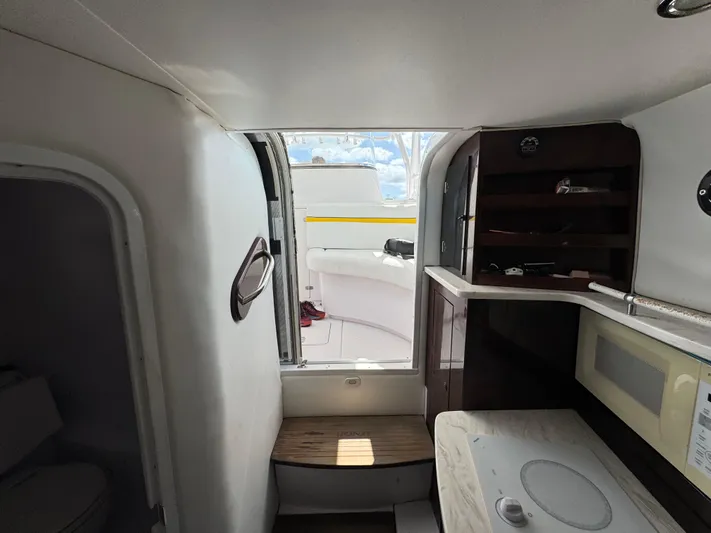 Singularity Yacht Photos Pics Interior view of a 2006 Donzi 38 ZSF boat, featuring compact cabin amenities.