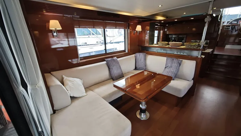 Beneteau Swift Trawler 52 Yacht Photos Pics Luxurious interior of 2011 Beneteau Swift Trawler 52 with elegant seating and wooden finishes.