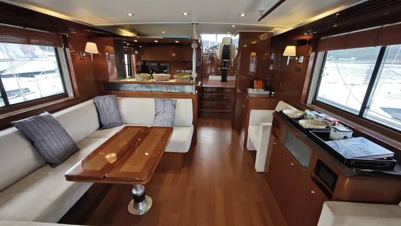 Beneteau Swift Trawler 52 Yacht Photos Pics Luxurious interior of 2011 Beneteau Swift Trawler 52 with elegant seating and dining area.