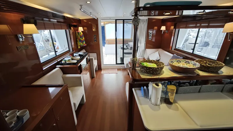 Beneteau Swift Trawler 52 Yacht Photos Pics Interior of 2011 Beneteau Swift Trawler 52, featuring elegant wood finishes and cozy seating.