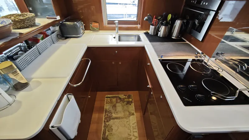 Beneteau Swift Trawler 52 Yacht Photos Pics 2011 Beneteau Swift Trawler 52 kitchen with modern appliances and sleek countertops.