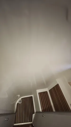 Beneteau Swift Trawler 52 Yacht Photos Pics Interior view of 2011 Beneteau Swift Trawler 52 with wooden flooring and white walls.