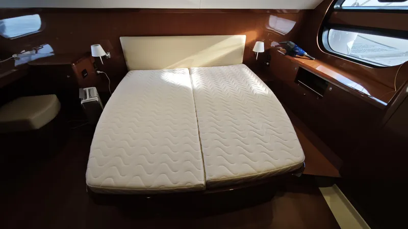 Beneteau Swift Trawler 52 Yacht Photos Pics Luxurious cabin interior of 2011 Beneteau Swift Trawler 52 with double bed.