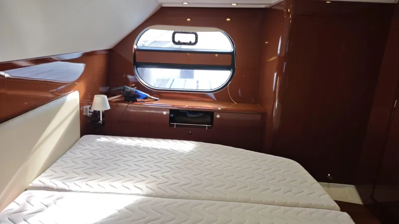 Beneteau Swift Trawler 52 Yacht Photos Pics Luxurious cabin interior of 2011 Beneteau Swift Trawler 52 with elegant wood finish.