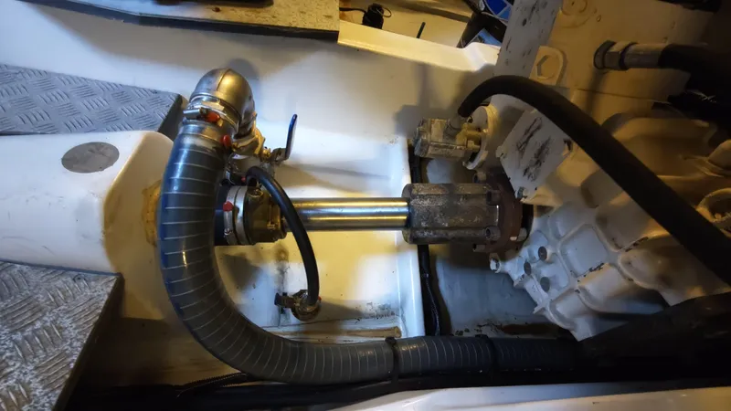 Beneteau Swift Trawler 52 Yacht Photos Pics Engine compartment of a 2011 Beneteau Swift Trawler 52, showing mechanical components and hoses.