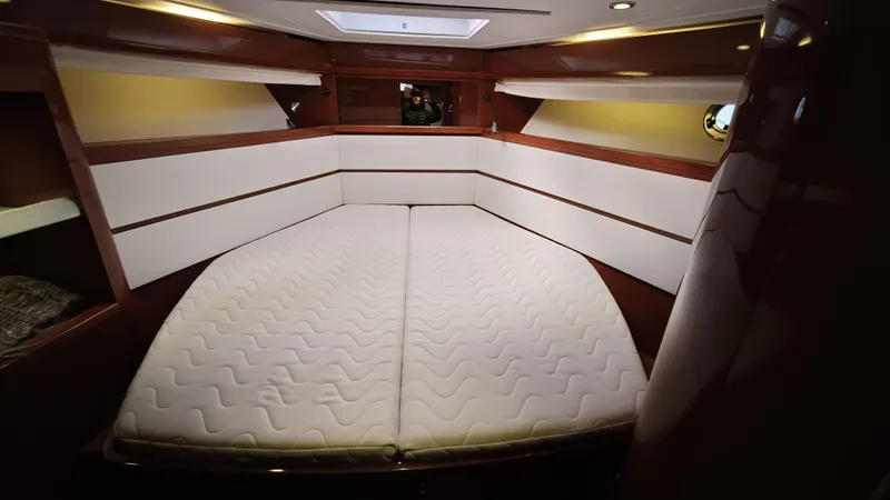 Beneteau Swift Trawler 52 Yacht Photos Pics Luxurious cabin interior of 2011 Beneteau Swift Trawler 52 with spacious bed.