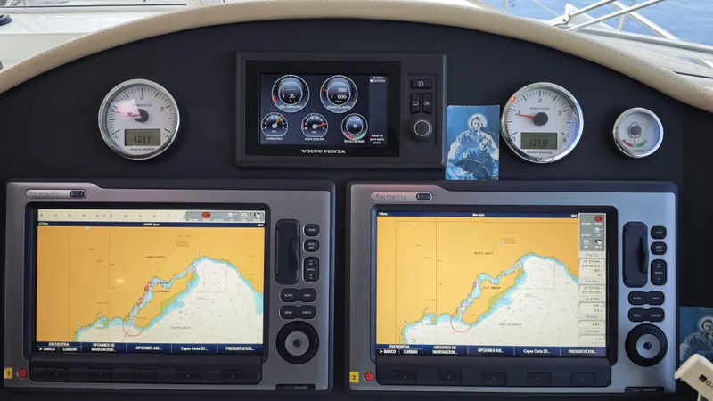 Beneteau Swift Trawler 52 Yacht Photos Pics Dashboard of a 2011 Beneteau Swift Trawler 52 with navigation screens and gauges.