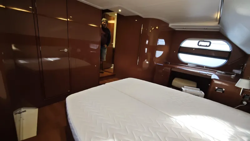 Beneteau Swift Trawler 52 Yacht Photos Pics Luxurious cabin interior of 2011 Beneteau Swift Trawler 52 with modern furnishings.