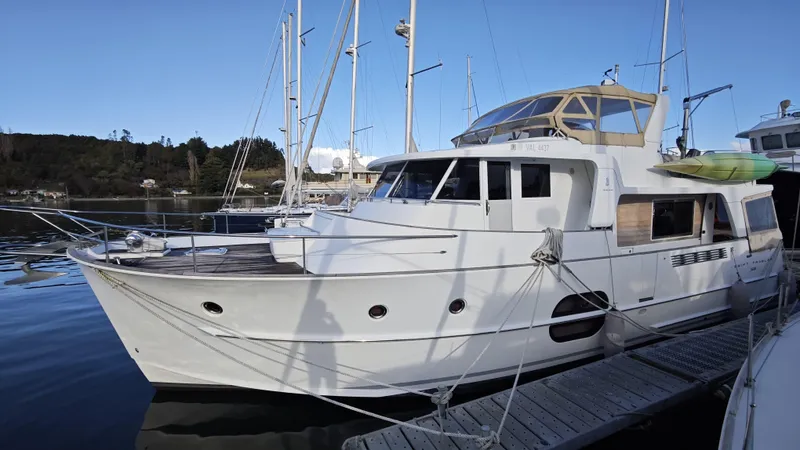Beneteau Swift Trawler 52 Yacht Photos Pics 2011 Beneteau Swift Trawler 52 docked at marina, clear sky background.