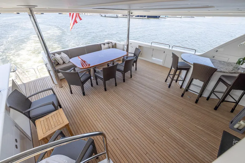 Seahawk Yacht Photos Pics Luxurious 2014 Westport Motoryacht deck with seating, dining table, and ocean view.