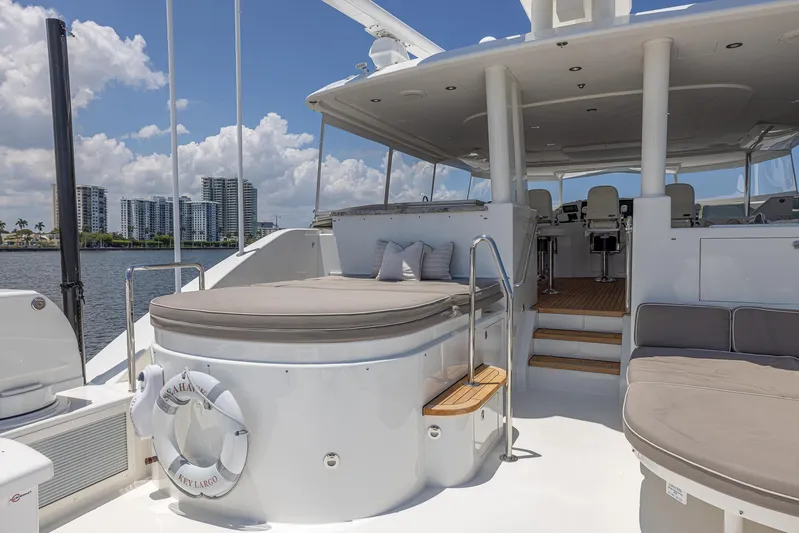 Seahawk Yacht Photos Pics Luxurious 2014 Westport Motoryacht deck with seating, overlooking waterfront skyline.