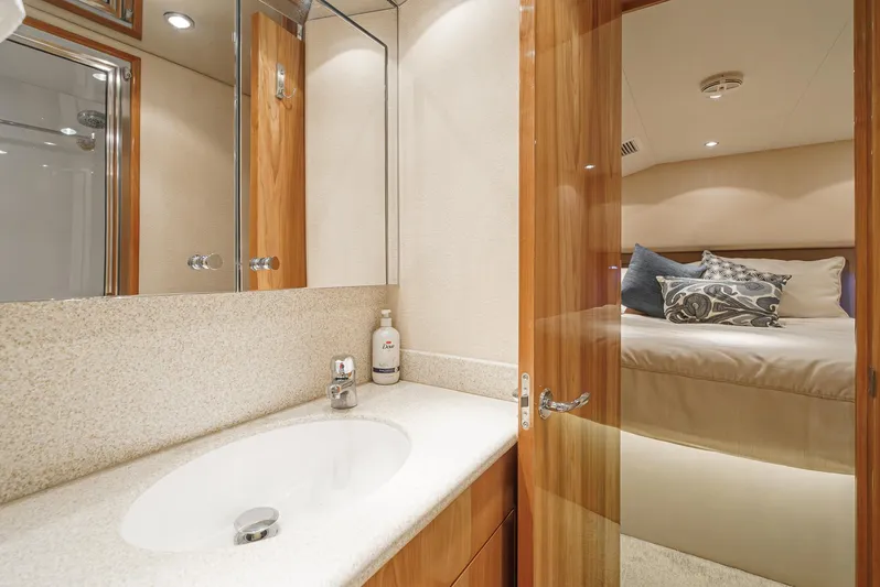 Whiplash II Yacht Photos Pics Luxurious bathroom and bedroom interior of 2006 Hatteras 50 Convertible yacht.