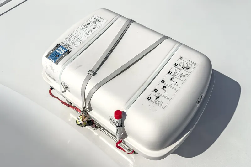 Whiplash II Yacht Photos Pics Life raft on 2006 Hatteras 50 Convertible yacht deck, secured with straps.