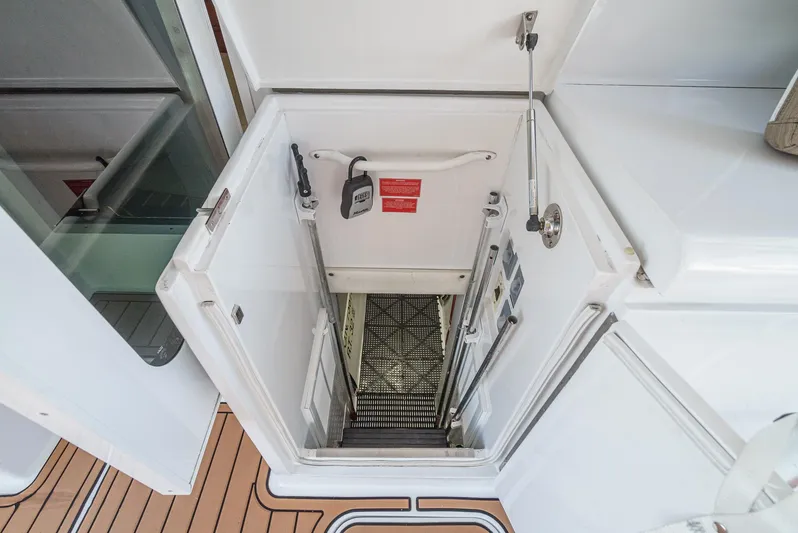 Whiplash II Yacht Photos Pics Hatteras 50 Convertible 2006 yacht engine room access hatch with secure latch and safety features.