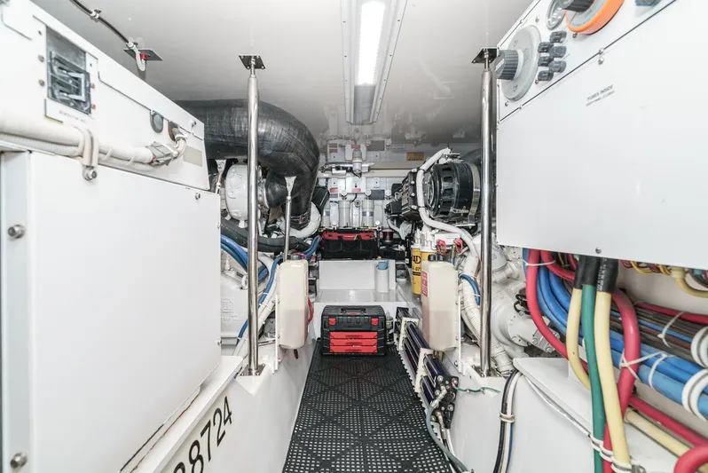 Whiplash II Yacht Photos Pics Engine room of 2006 Hatteras 50 Convertible yacht, showcasing machinery and wiring.