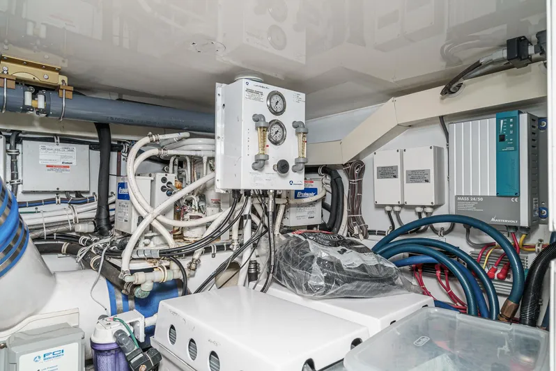 Whiplash II Yacht Photos Pics Engine room of 2006 Hatteras 50 Convertible yacht with complex wiring and equipment.