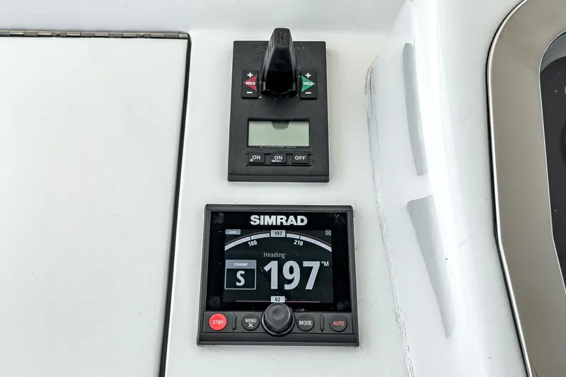 Whiplash II Yacht Photos Pics Simrad navigation system on 2006 Hatteras 50 Convertible yacht dashboard.