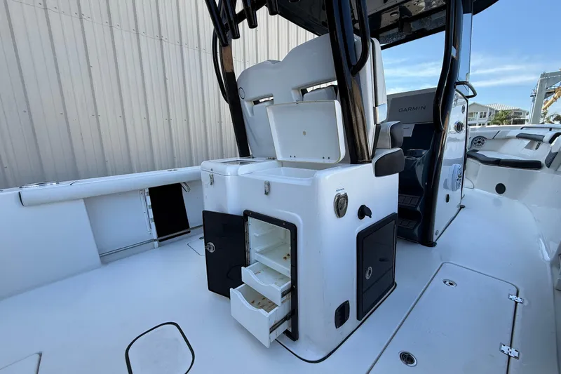  Yacht Photos Pics 2022 Tidewater 292 CC Adventure boat interior with open storage compartments.