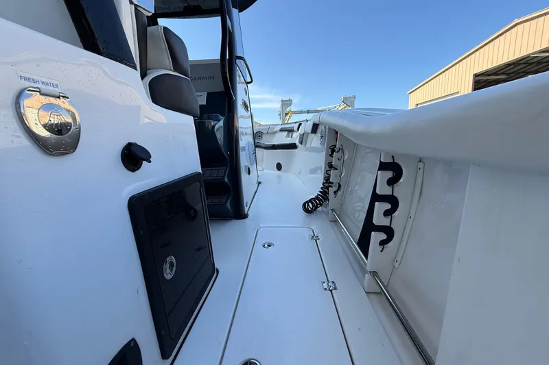  Yacht Photos Pics 2022 Tidewater 292 CC Adventure boat interior with fresh water access and seating.