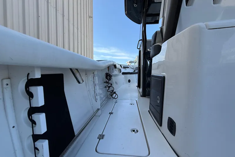  Yacht Photos Pics 2022 Tidewater 292 CC Adventure boat interior, showcasing sleek design and storage features.