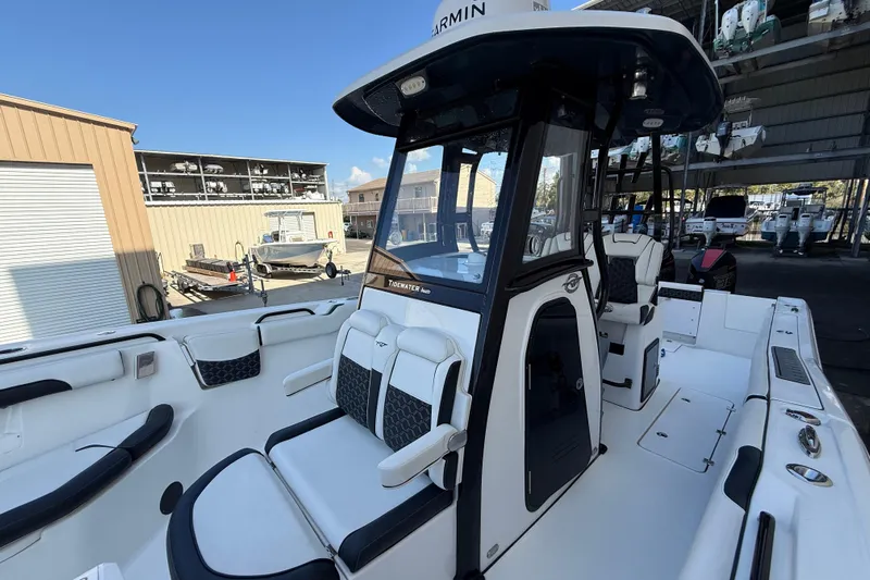  Yacht Photos Pics 2022 Tidewater 292 CC Adventure boat with sleek design and spacious seating.