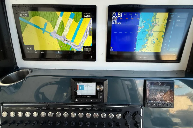  Yacht Photos Pics Dashboard of 2022 Tidewater 292 CC Adventure with Garmin navigation displays.