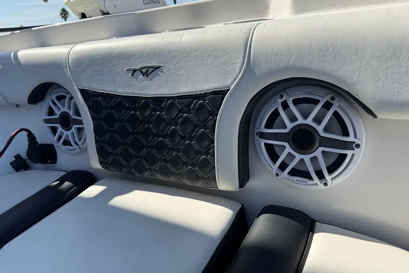  Yacht Photos Pics 2022 Tidewater 292 CC Adventure boat interior with JL Audio speakers and stylish upholstery.