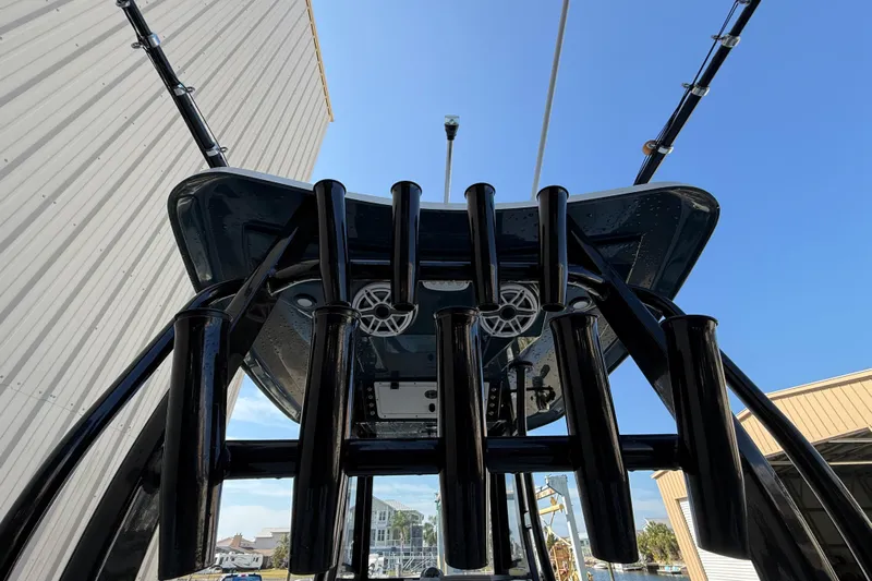  Yacht Photos Pics 2022 Tidewater 292 CC Adventure boat with rod holders and T-top, viewed from below.