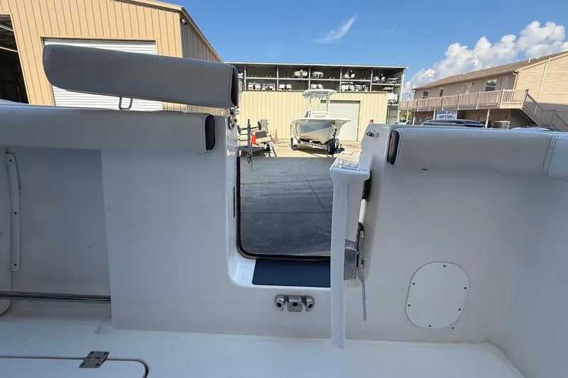  Yacht Photos Pics 2022 Tidewater 292 CC Adventure boat interior with open transom door.