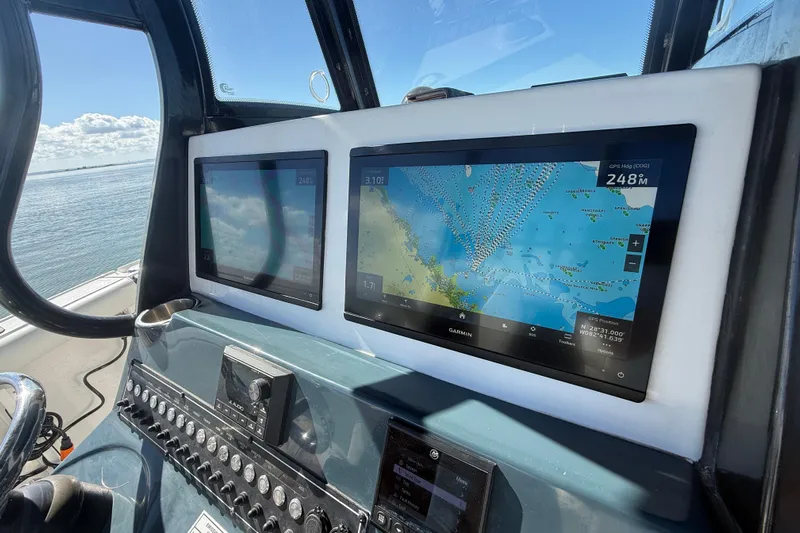  Yacht Photos Pics Dashboard of 2022 Tidewater 292 CC Adventure with Garmin navigation screens.