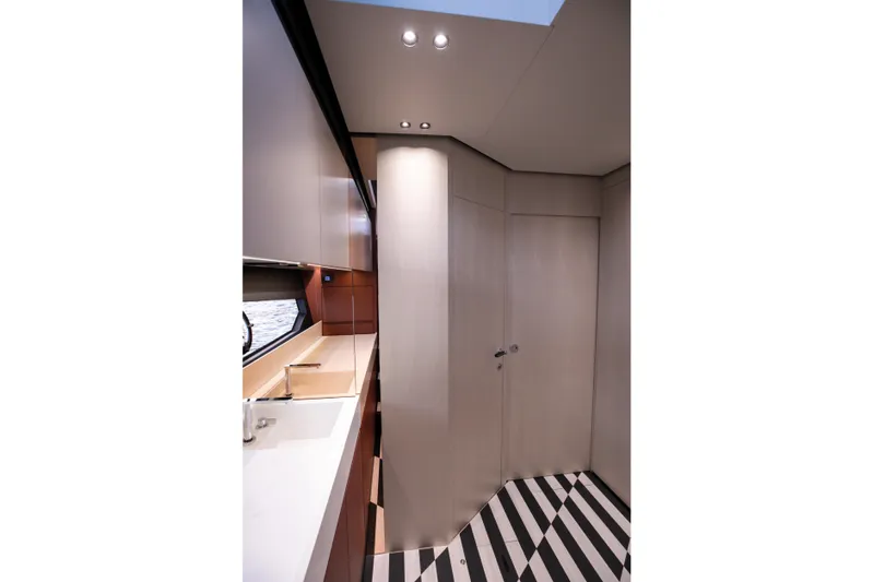  Yacht Photos Pics Modern interior of 2026 FIM 500 Regina yacht with sleek design and striped flooring.