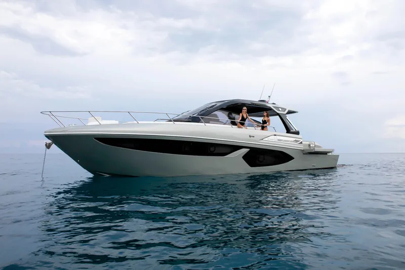  Yacht Photos Pics 2026 FIM 500 Regina yacht on calm sea with two people onboard.