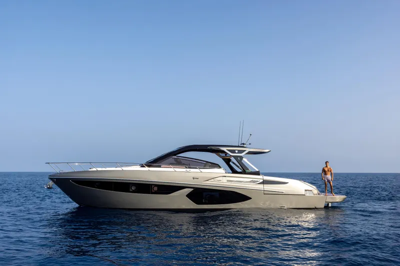  Yacht Photos Pics 2026 FIM 500 Regina yacht on open sea with person standing on deck.