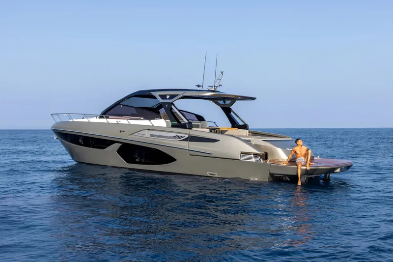  Yacht Photos Pics Luxury 2026 FIM 500 Regina yacht on open sea with person relaxing.