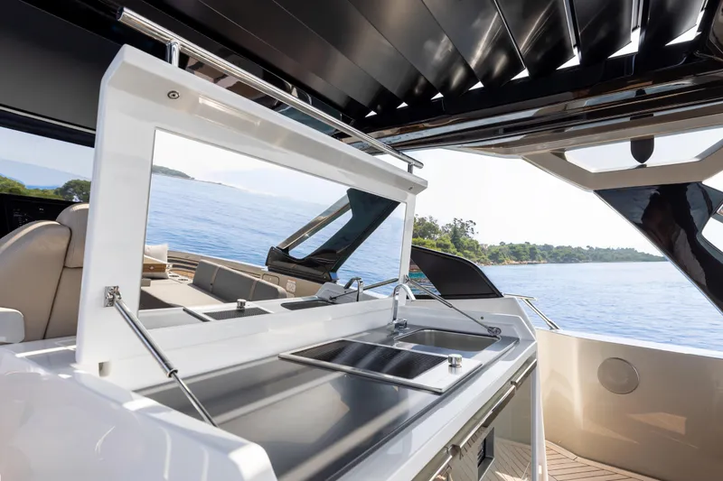  Yacht Photos Pics Luxurious FIM 500 Regina yacht interior with sleek kitchen, overlooking serene ocean view, 2026 model.