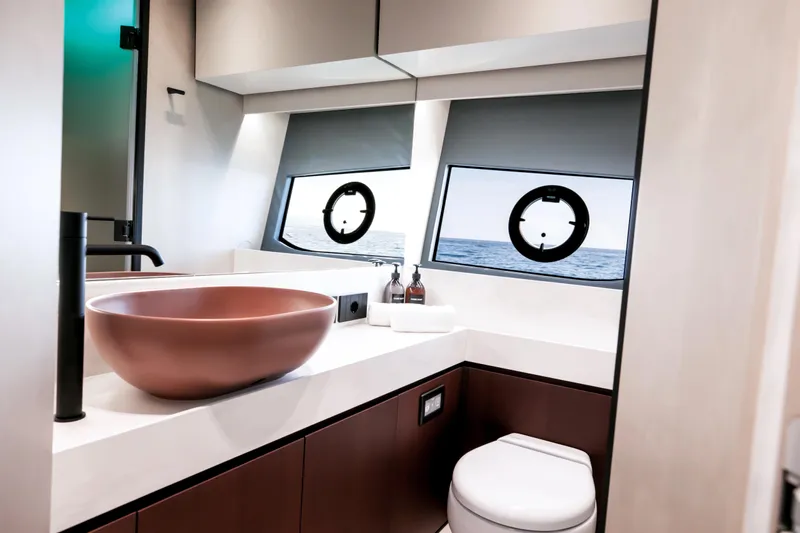  Yacht Photos Pics Luxurious bathroom on 2026 FIM 500 Regina yacht with ocean view and modern fixtures.