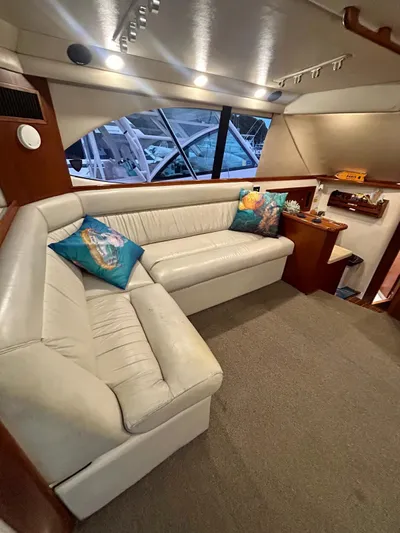  Yacht Photos Pics Luxurious interior of 2002 Riviera Convertible 37 yacht with plush seating and vibrant cushions.