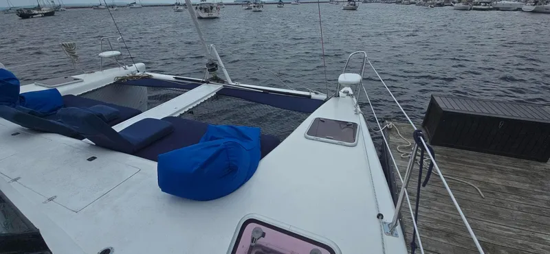 Bellagio Yacht Photos Pics Kelsall Suncat 40 catamaran, 2013 model, docked with blue seating, overlooking marina.