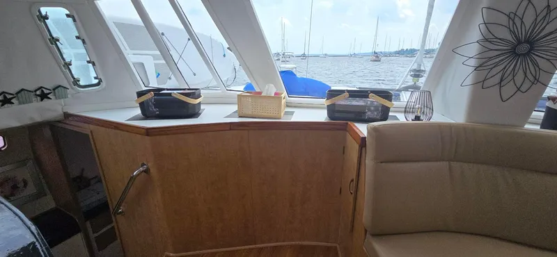 Bellagio Yacht Photos Pics Interior of 2013 Kelsall Suncat 40 yacht with wooden cabinetry and sea view.