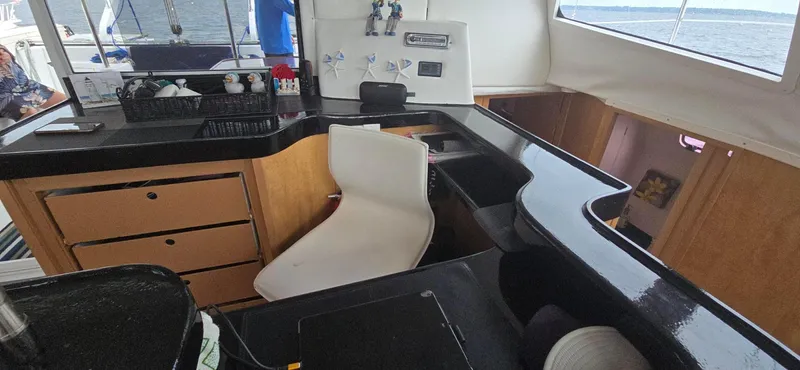 Bellagio Yacht Photos Pics Interior of 2013 Kelsall Suncat 40 yacht with modern kitchen and seating area.