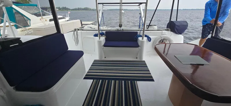 Bellagio Yacht Photos Pics Spacious deck of 2013 Kelsall Suncat 40 with seating and table, overlooking water.