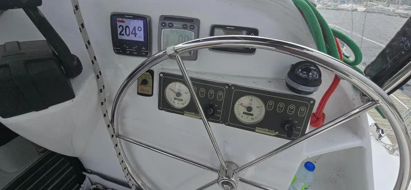 Bellagio Yacht Photos Pics Helm of 2013 Kelsall Suncat 40 with navigation instruments and steering wheel.